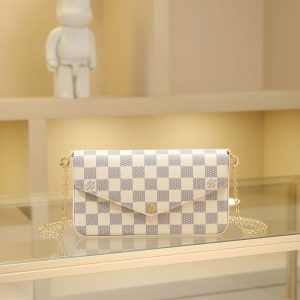 Pochette Felicie is an elegant and compact handbag featuring two detachable pockets, making it a stylish choice for carrying and organizing your daily essentials. More than just a wallet, it transforms into a charming clutch or small handbag when the gold chain is removed.- 1 flat inner pocket - Two detachable components: a zippered pocket with leather pull tab and a flat flap pouch with 8 credit card slots - Detachable shiny gold chain - Button closure - Calfskin trim - Fabric lining - Shiny gold-tone hardware Dimensions: 21*11*2 cm